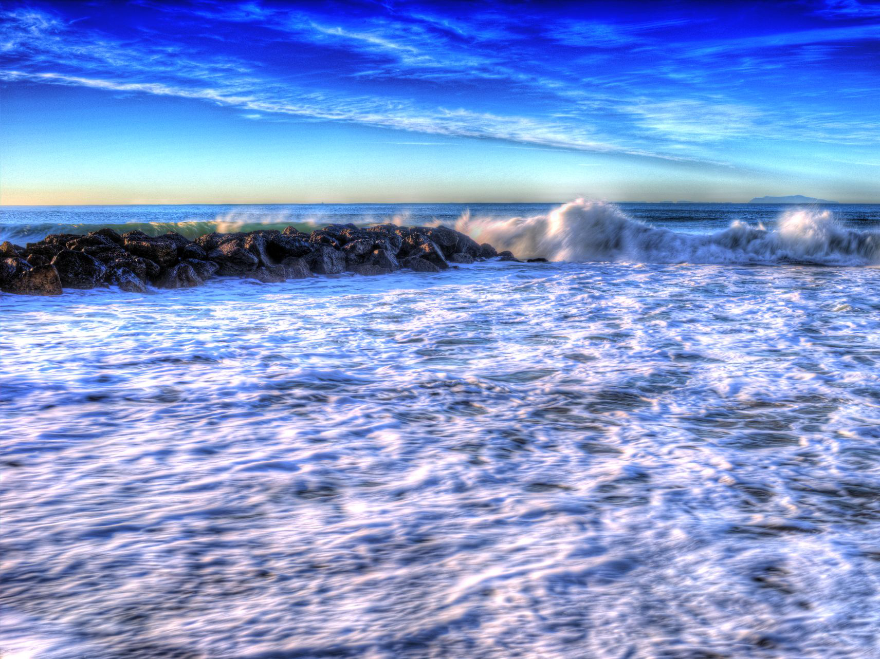 Dynamic ocean waves representing creative energy